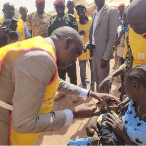 Local official administering the polio vaccine during the Polio SIA launch in South Sudan.