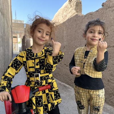 Children in Herat, Afghanistan, show their inked fingers—a sign they have been vaccinated against polio. © WHO/Afghanistan