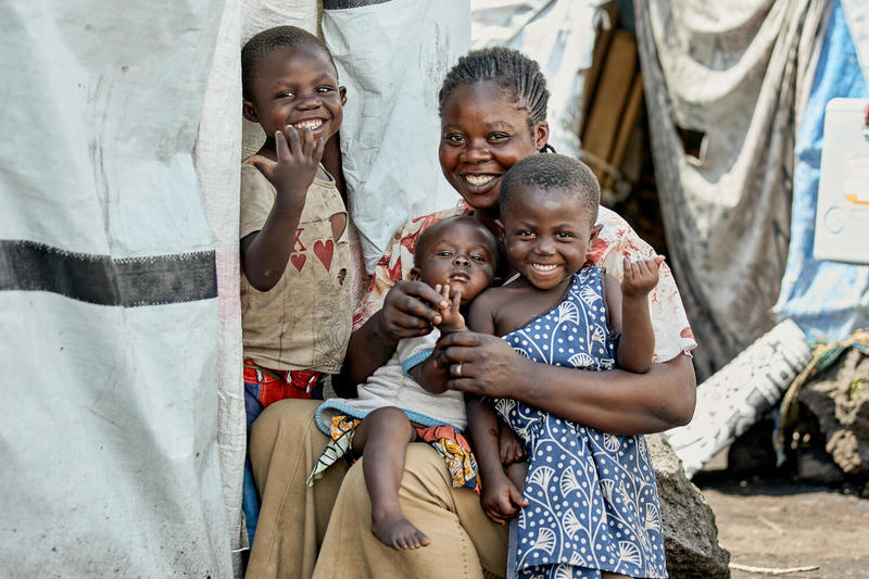 Muhindo, 5, and his two sisters proudly show off thir marked fingers after being vaccinated against polio at the Buhimba IDP site in Goma, North Kivu, DR Congo, on April 10, 2024.