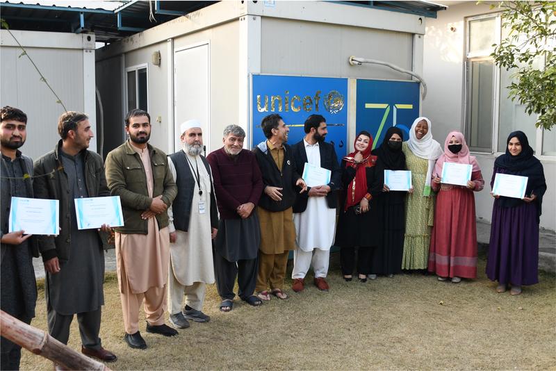 Community leaders proudly hold certificates after sanitation training, highlighting the power of local leadership in tackling polio. Photo: UNICEF/2024/Afghanistan