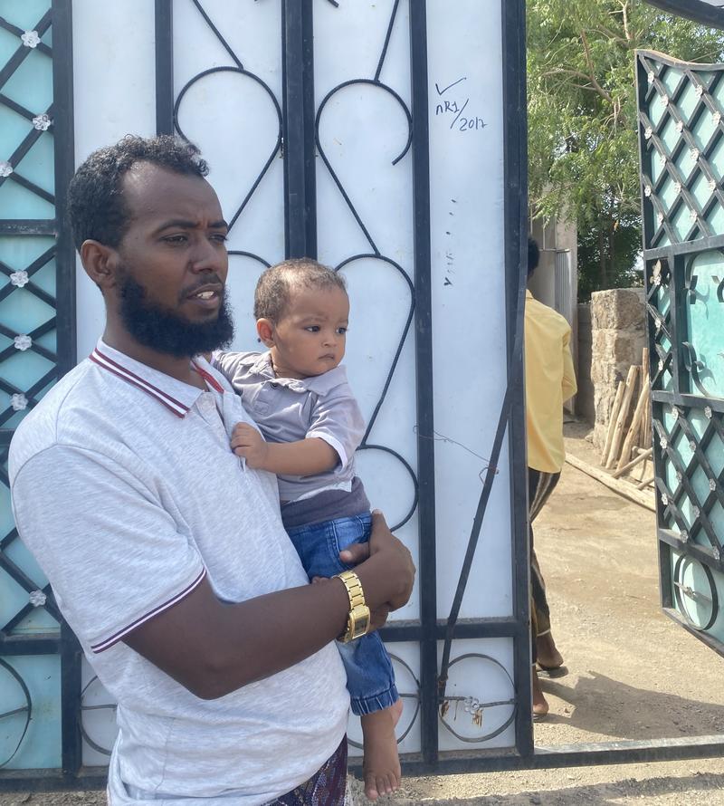 Esmail Yenus stands with his children, representing the critical role fathers can play in ensuring access to life-saving vaccines.