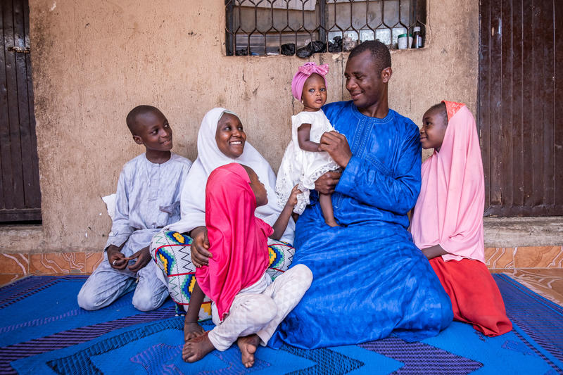 Family with four kids smilling