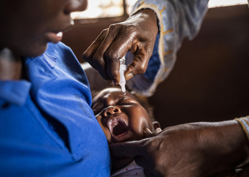 Children taking the polio vaccine drops.