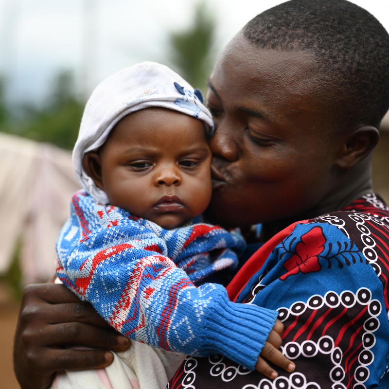 Dad kissing his baby