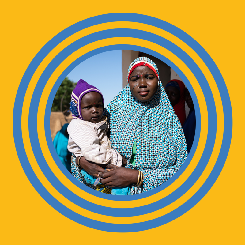 Mother holding her child in the middle of a blue circle