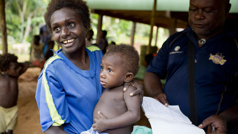 Mother taking child to get the vaccine