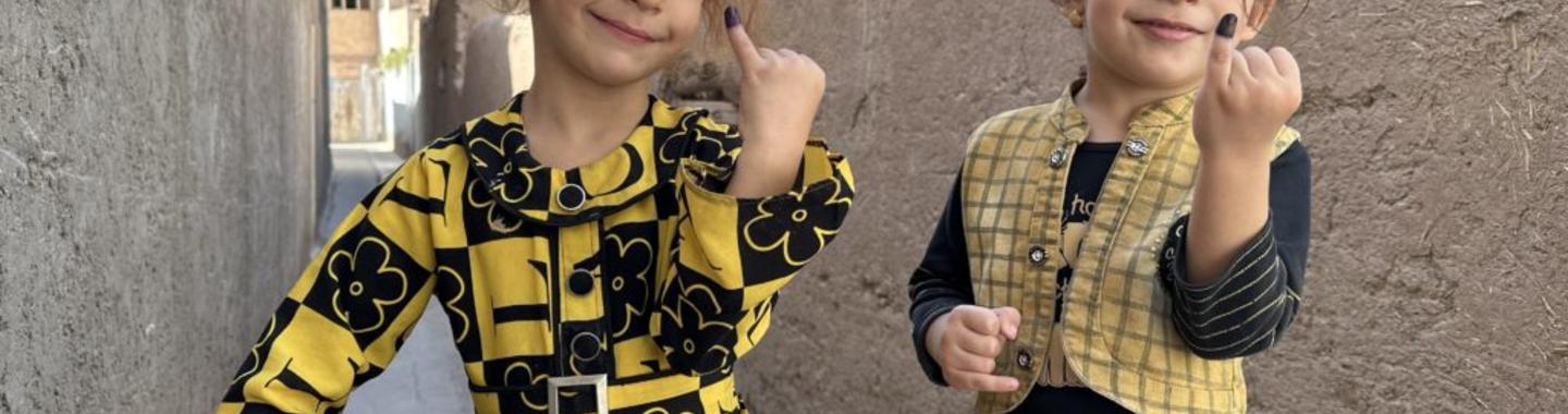 Children in Herat, Afghanistan, show their inked fingers—a sign they have been vaccinated against polio. © WHO/Afghanistan
