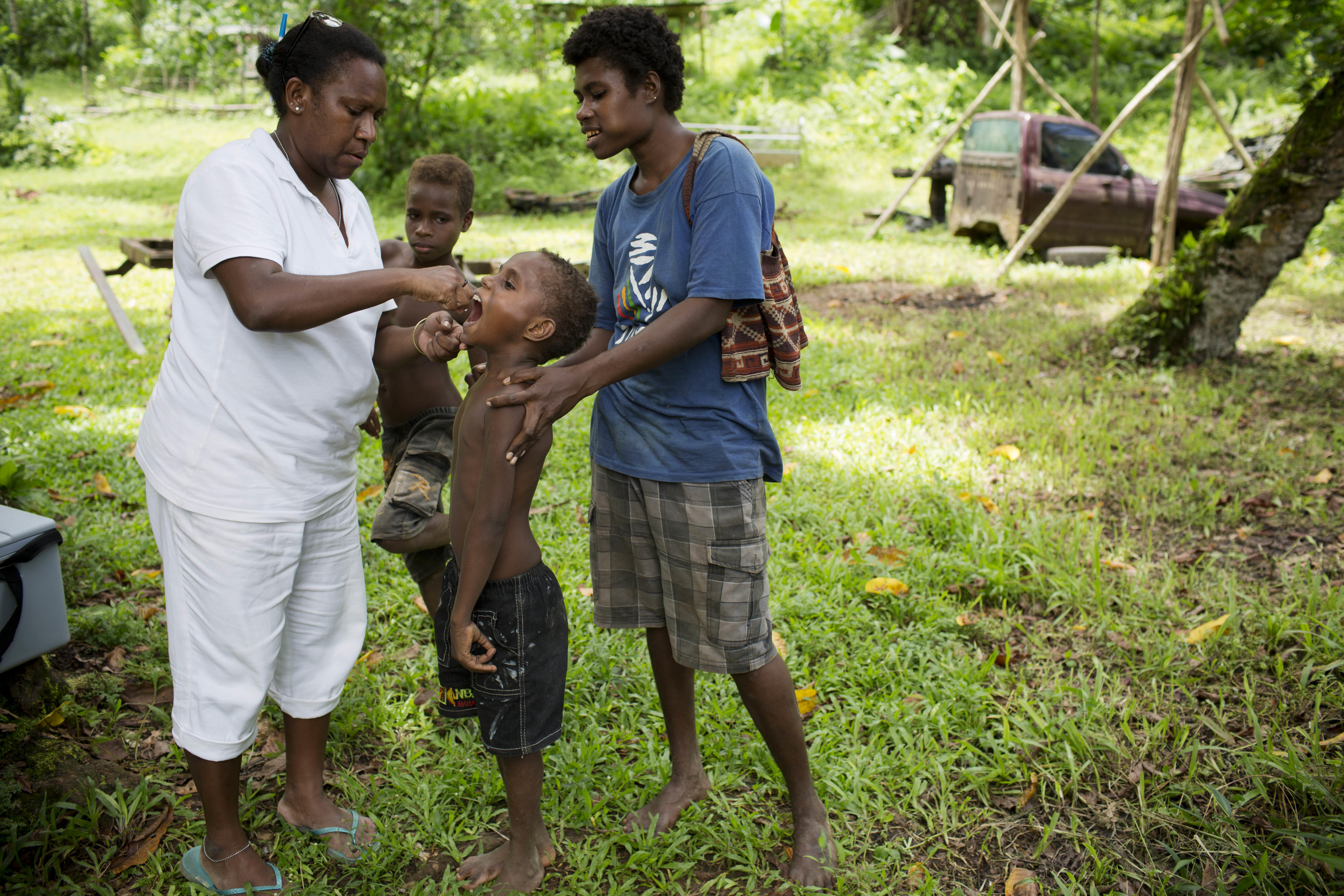Woman taking kid to take the vaccine